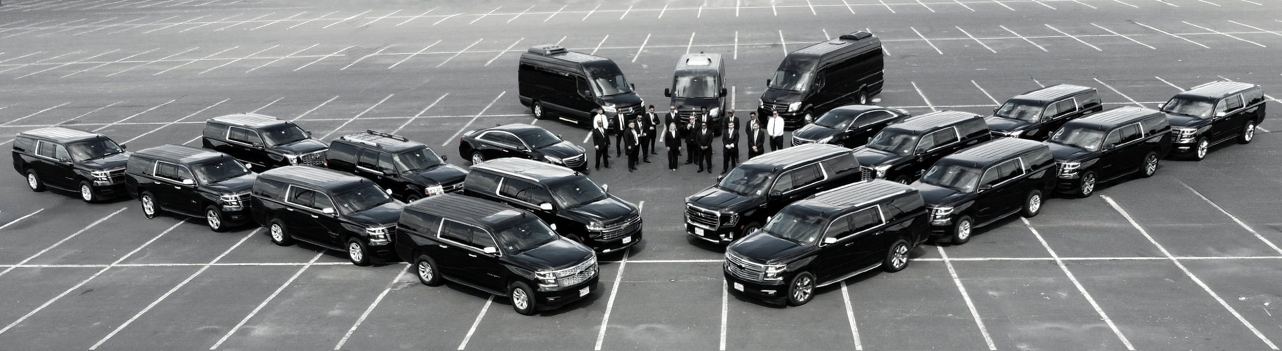 VIP DRVR fleet lineup — luxury black SUVs and vans with professional chauffeurs